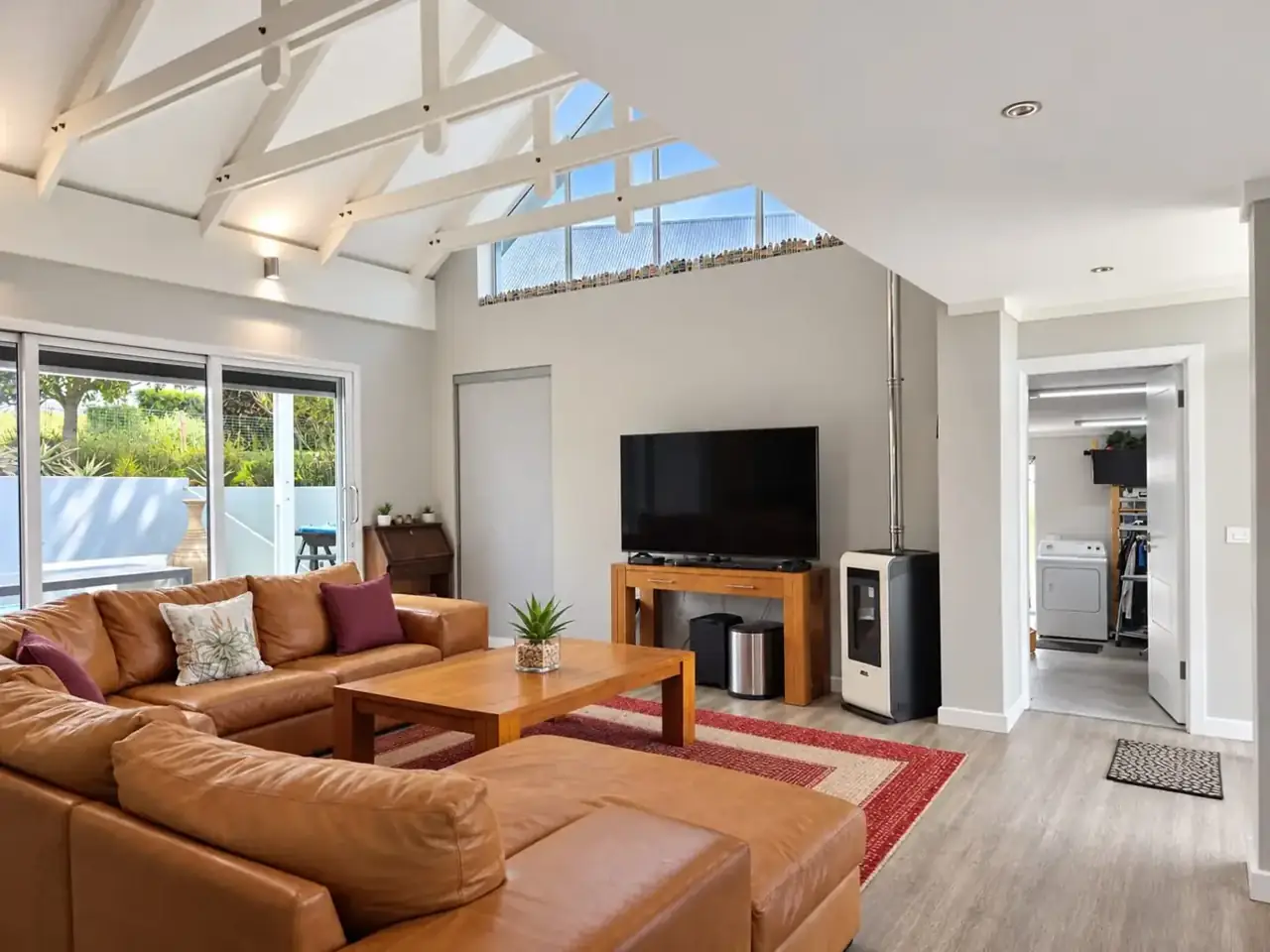 Moxie House — Caramel leather lounge, fireplace and pool access