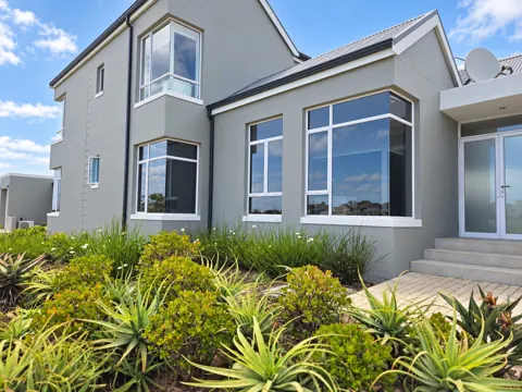 Moxie House — Grey exterior and planted garden