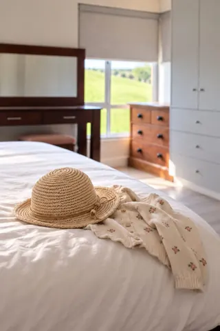 Moxie House — Bedroom with natural wood furniture