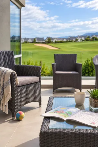 Moxie House — Balcony seating and open green outlook