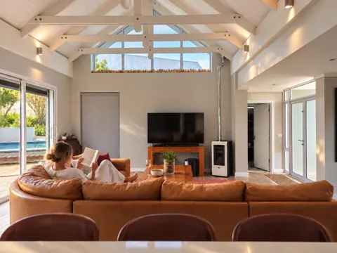 Moxie House — Reading beneath white timber beams
