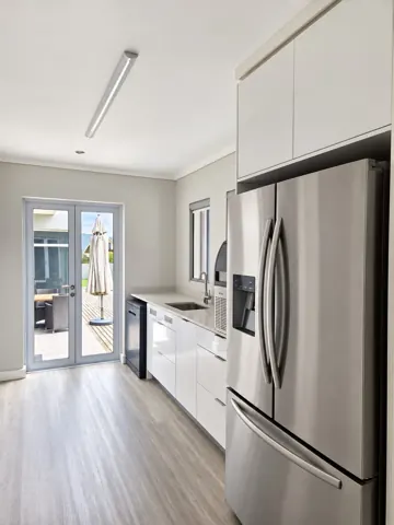 Moxie House — Kitchen utility area and courtyard door