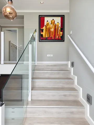 Moxie House — Internal staircase with colourful artwork