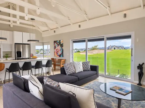 Moxie House — Upstairs charcoal lounge and open-plan kitchen