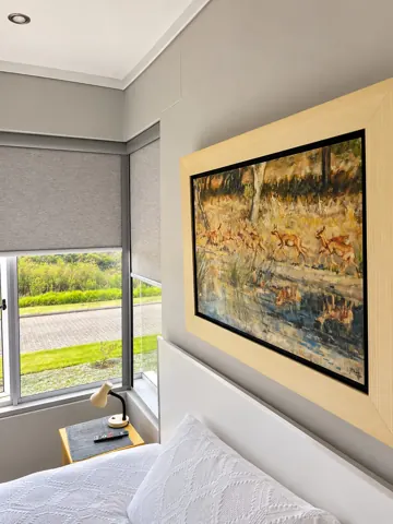 Moxie House — Bedroom window and framed artwork