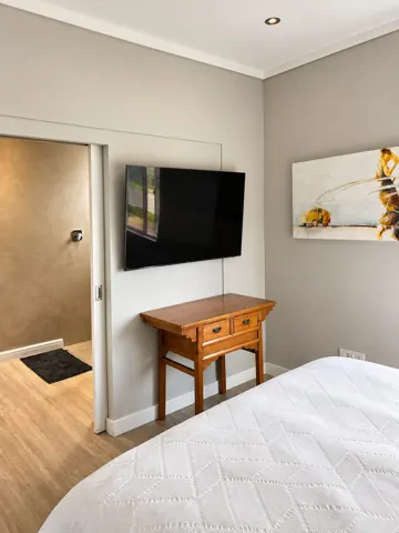 Moxie House — Bedroom and adjoining bathroom entrance