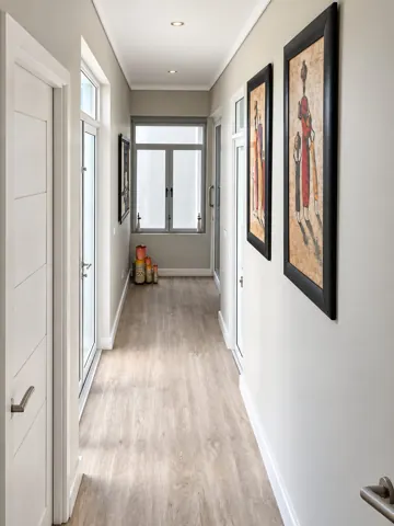 Moxie House — Hallway with framed artwork